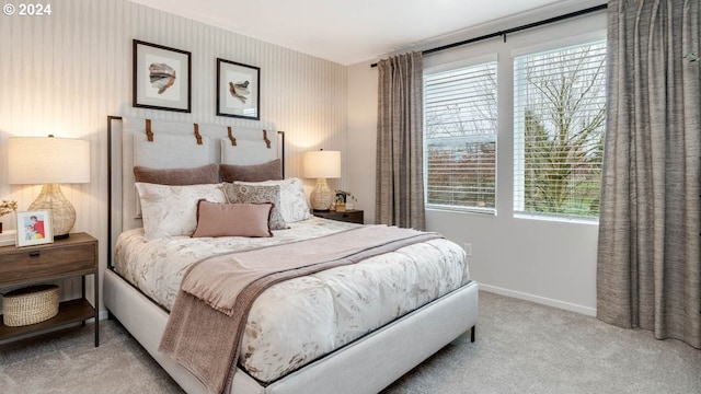 bedroom featuring light colored carpet