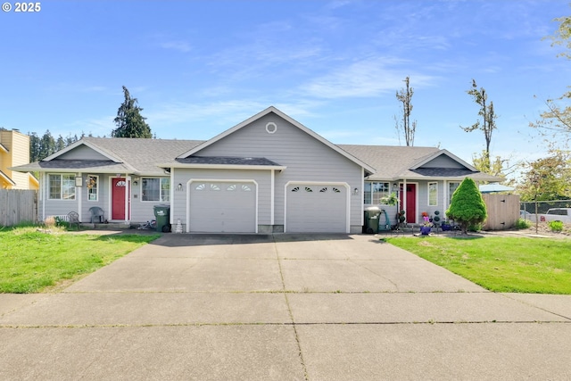 ranch-style house featuring a shingled roof, an attached garage, driveway, and a front yard