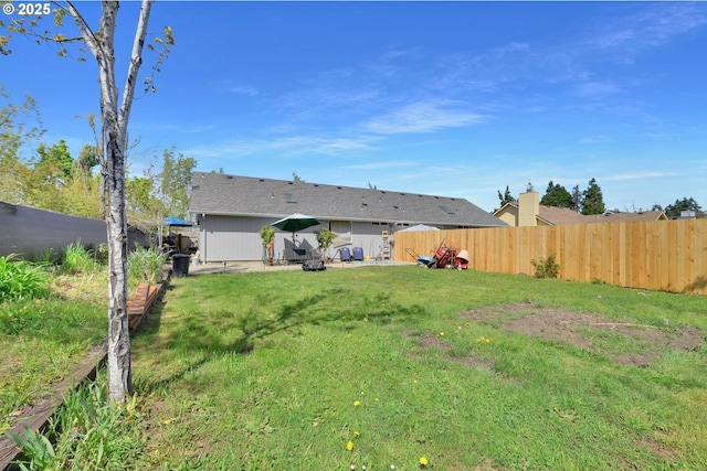 view of yard featuring a fenced backyard