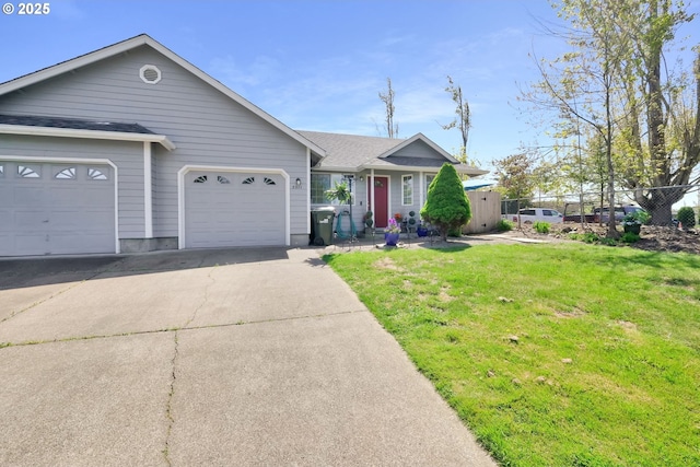 ranch-style house with fence, a front lawn, concrete driveway, an attached garage, and a shingled roof