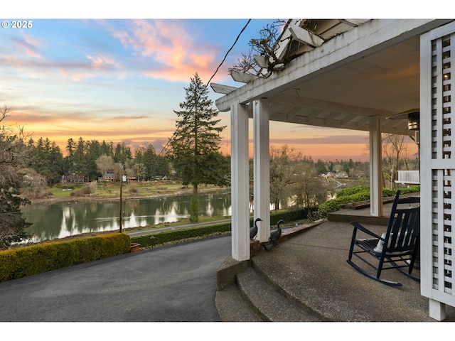 patio terrace at dusk with a water view