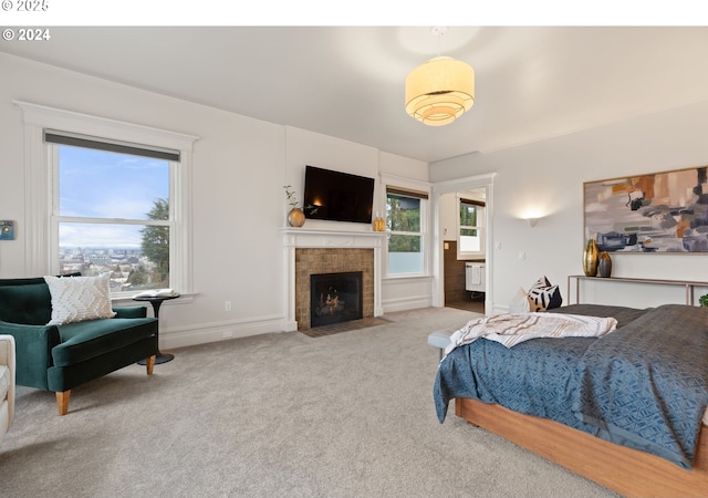 carpeted bedroom with radiator and a tile fireplace