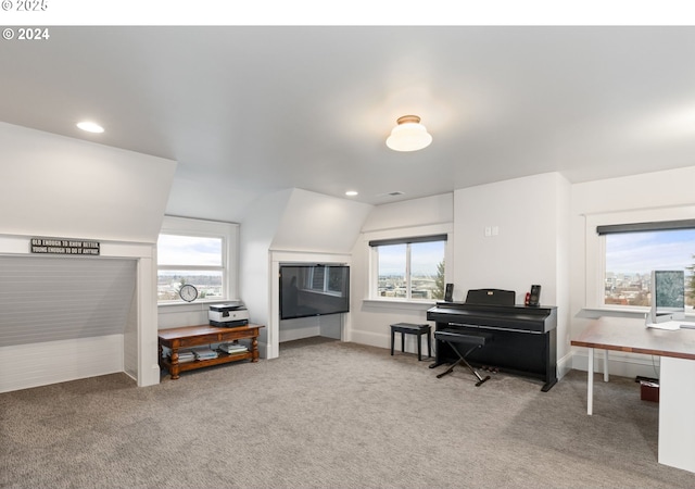 interior space featuring lofted ceiling and carpet flooring