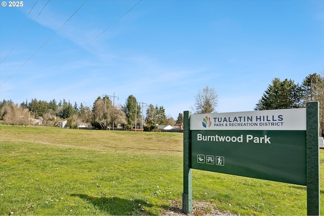 view of property's community with a lawn