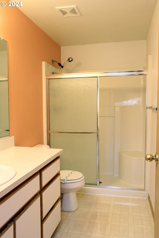 2309 SE 90th Ave, Portland, OR 97216 - bathroom featuring vanity, a shower stall, and toilet