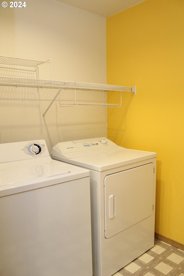 2309 SE 90th Ave, Portland, OR 97216 - laundry area featuring washing machine and clothes dryer, light floors, and baseboards