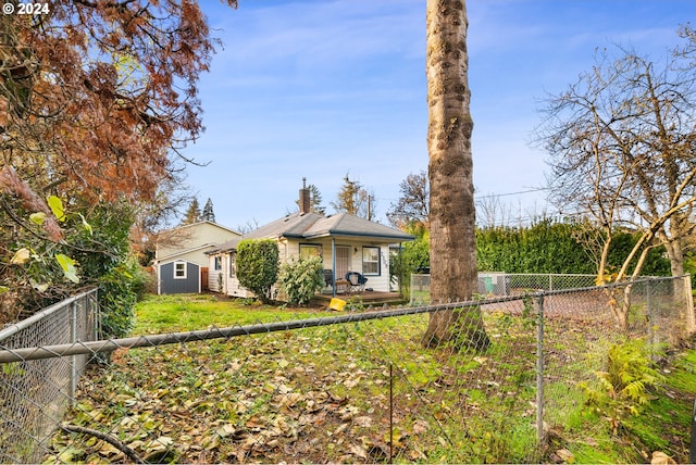 2309 SE 90th Ave, Portland, OR 97216 - view of front of home with a fenced backyard and a chimney
