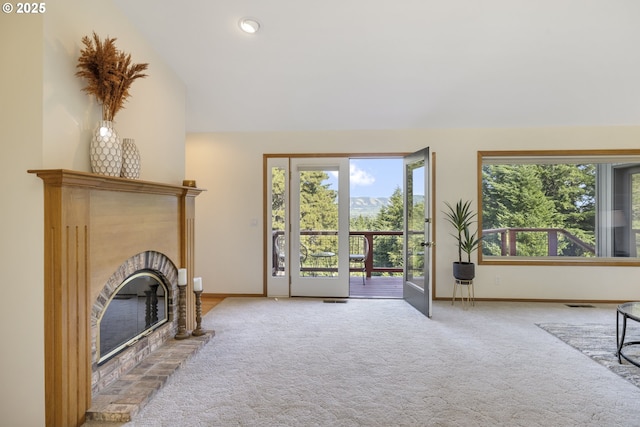 4719 Westwood Dr, Hood River, OR 97031 - carpeted living area featuring baseboards, a fireplace, and high vaulted ceiling