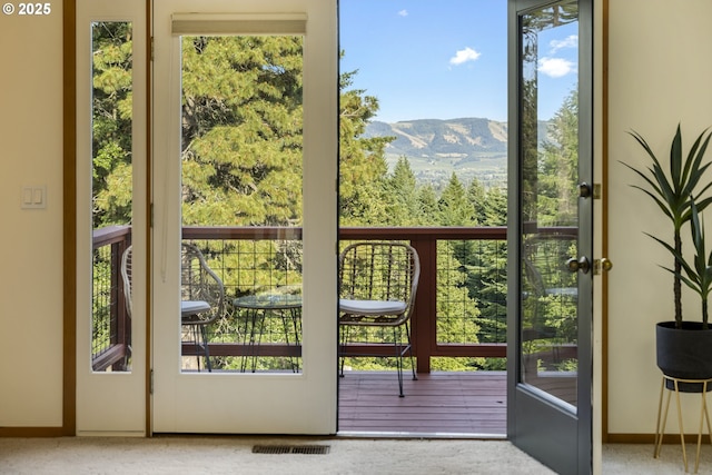 4719 Westwood Dr, Hood River, OR 97031 - doorway to outside with plenty of natural light, a mountain view, carpet floors, and baseboards