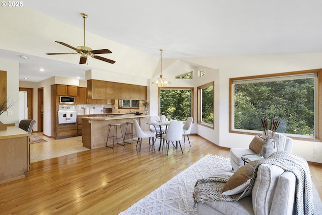 4719 Westwood Dr, Hood River, OR 97031 - living room featuring light wood-style floors, vaulted ceiling, a ceiling fan, and recessed lighting
