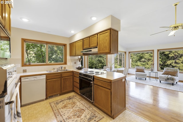 4719 Westwood Dr, Hood River, OR 97031 - kitchen featuring black electric range, white dishwasher, a sink, a peninsula, and under cabinet range hood