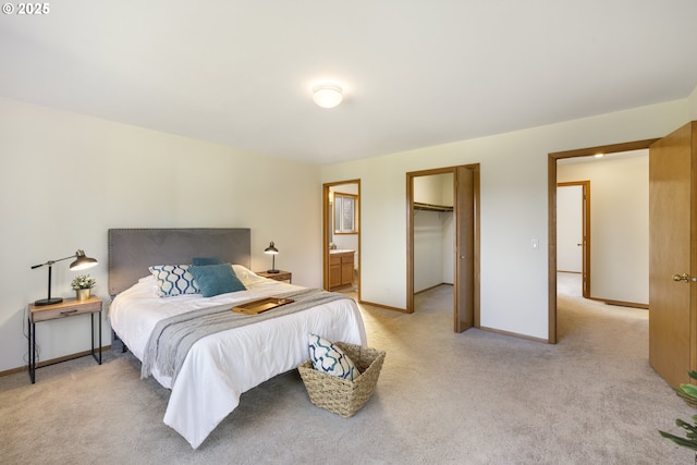 4719 Westwood Dr, Hood River, OR 97031 - bedroom with baseboards, light carpet, a spacious closet, and ensuite bath