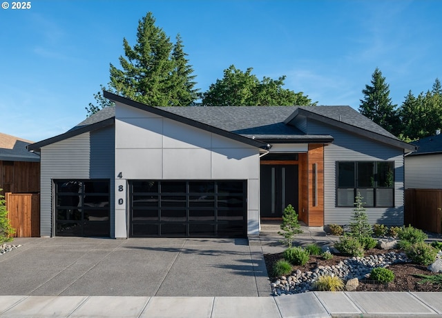 480 W U St, Washougal, WA 98671 - modern home featuring an attached garage, concrete driveway, and roof with shingles