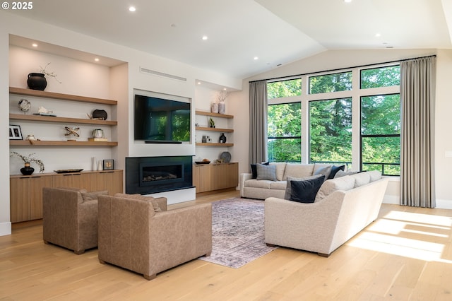 480 W U St, Washougal, WA 98671 - living area with light wood-type flooring, a glass covered fireplace, lofted ceiling, and recessed lighting