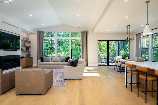 480 W U St, Washougal, WA 98671 - living area with light wood-style floors, vaulted ceiling, baseboards, and a fireplace