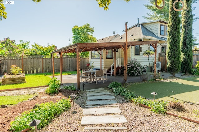 view of yard with a patio area and a vegetable garden