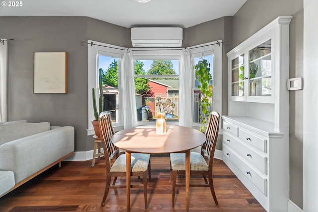 dining room featuring a wall mounted AC and dark wood-type flooring
