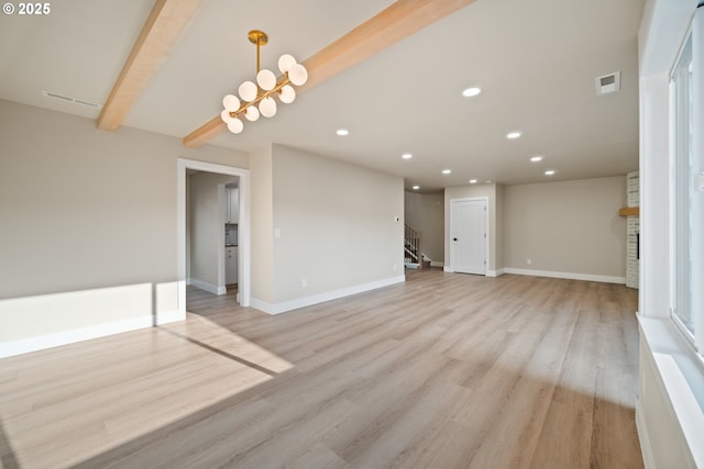 unfurnished living room featuring beam ceiling, a stone fireplace, and light wood-type flooring