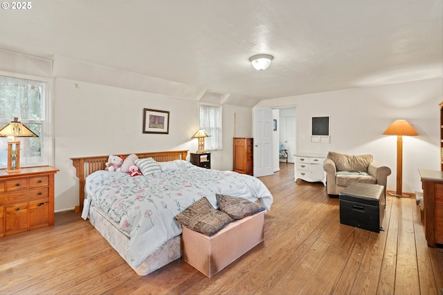 300 NE 148th Ave, Portland, OR 97230 - bedroom with light wood-style floors, multiple windows, and baseboards