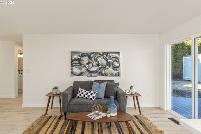 sitting room featuring light wood-type flooring