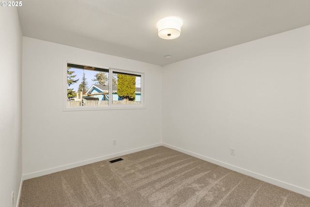 unfurnished room with carpet flooring