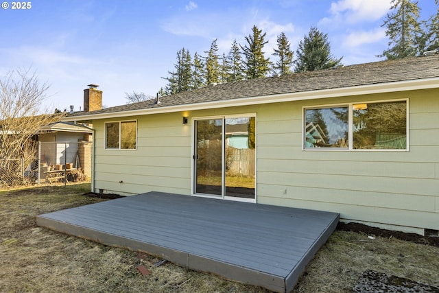 back of house with a wooden deck