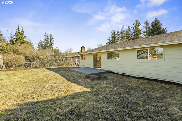 back of property with a patio area and a lawn