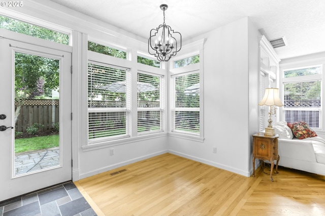 16800 NW Paddington Dr, Beaverton, OR 97006 - unfurnished sunroom featuring a chandelier and plenty of natural light