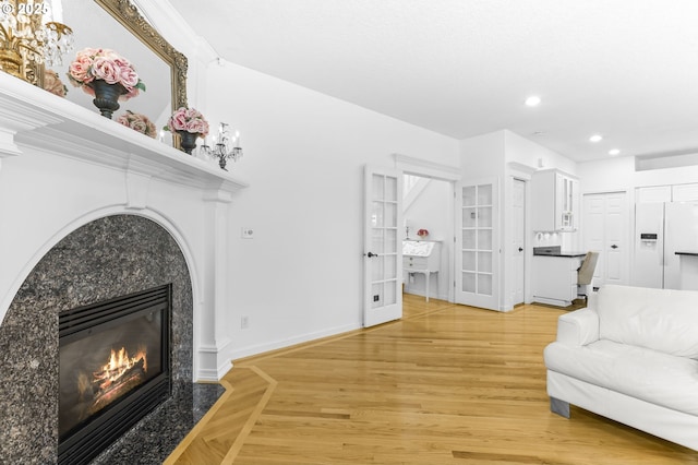 16800 NW Paddington Dr, Beaverton, OR 97006 - living room with a premium fireplace, recessed lighting, and light wood-type flooring