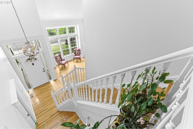 16800 NW Paddington Dr, Beaverton, OR 97006 - entrance foyer featuring a chandelier, wood finished floors, stairs, and high vaulted ceiling