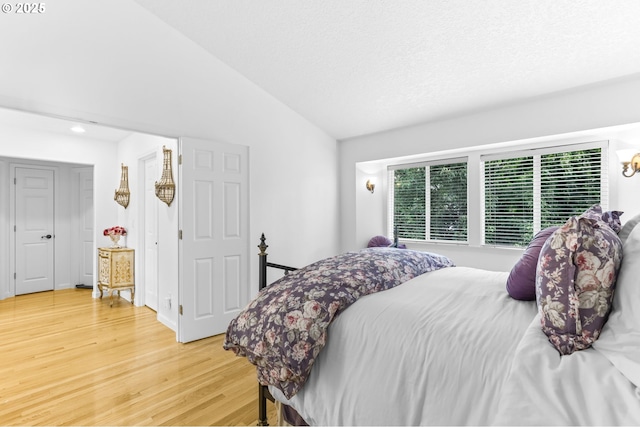 16800 NW Paddington Dr, Beaverton, OR 97006 - bedroom featuring vaulted ceiling, light wood-style floors, and recessed lighting