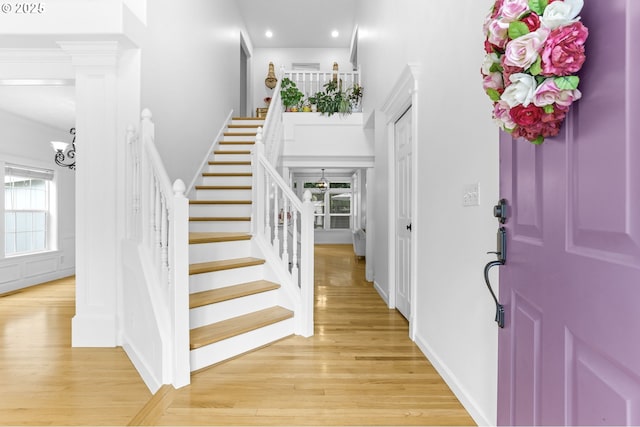 16800 NW Paddington Dr, Beaverton, OR 97006 - foyer entrance featuring stairway, light wood-style floors, recessed lighting, a chandelier, and a high ceiling