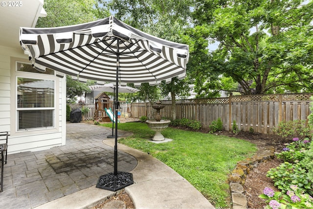 16800 NW Paddington Dr, Beaverton, OR 97006 - fenced backyard with a playground and a patio area
