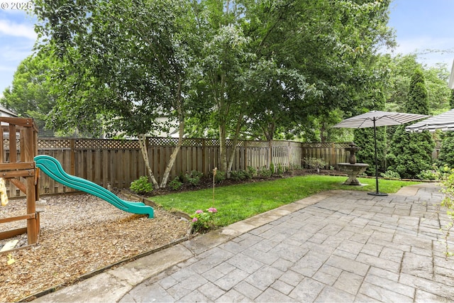 16800 NW Paddington Dr, Beaverton, OR 97006 - fenced backyard featuring a patio area and a playground