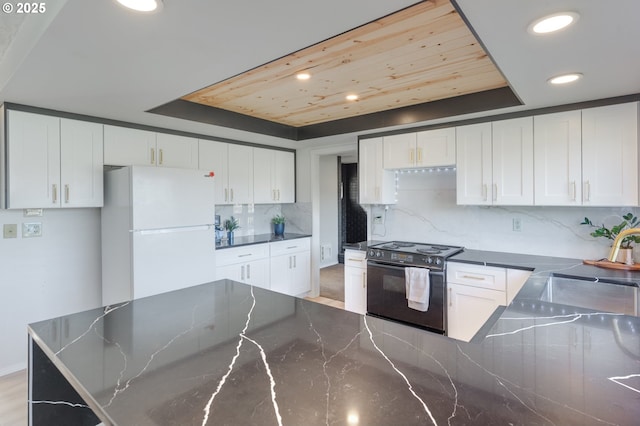 kitchen with wood ceiling, electric range, tasteful backsplash, white cabinets, and white fridge