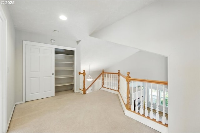 unfurnished bedroom with carpet flooring, a closet, baseboards, and recessed lighting