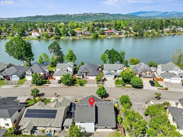 aerial perspective of suburban area with a water and mountain view