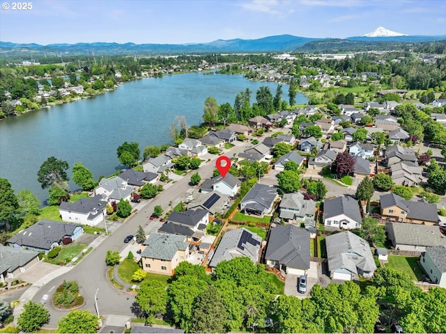 aerial perspective of suburban area featuring a water and mountain view