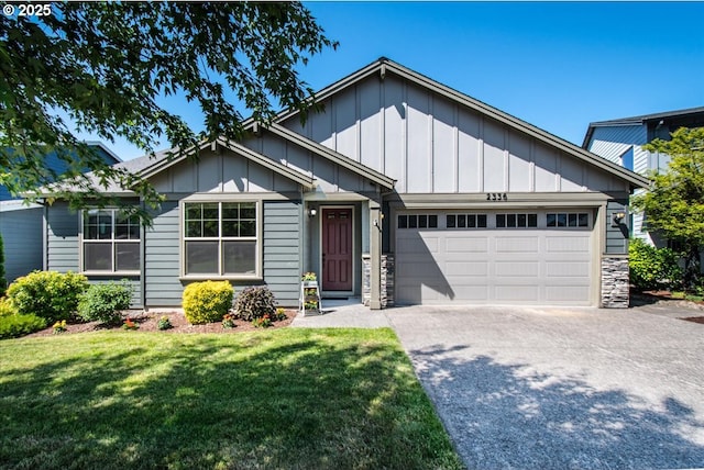 2336 Heather Way, Forest Grove, OR 97116 - view of front of home featuring board and batten siding, driveway, a garage, and a front yard