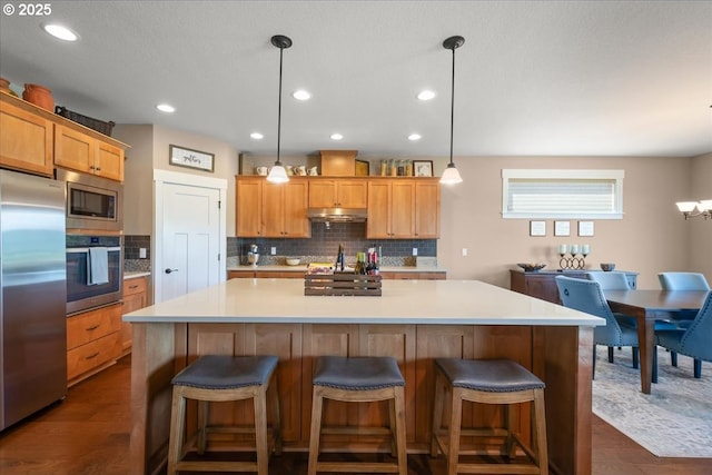 2336 Heather Way, Forest Grove, OR 97116 - kitchen with stainless steel appliances, decorative backsplash, light countertops, dark wood-style floors, and recessed lighting