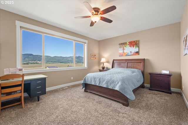 2336 Heather Way, Forest Grove, OR 97116 - bedroom with baseboards, carpet flooring, a mountain view, and a ceiling fan
