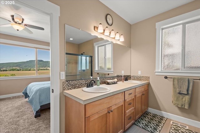 2336 Heather Way, Forest Grove, OR 97116 - bathroom featuring double vanity, healthy amount of natural light, a shower stall, and baseboards