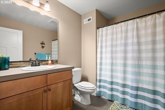 2336 Heather Way, Forest Grove, OR 97116 - bathroom featuring toilet, vanity, tile patterned flooring, and decorative backsplash