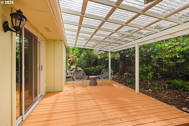 wooden deck with fence and a pergola