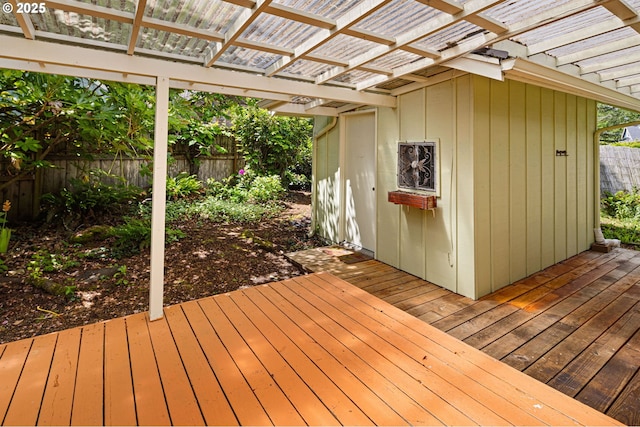 wooden deck with a pergola and a fenced backyard