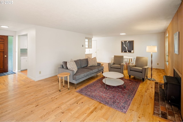 living room featuring wood finished floors and baseboards