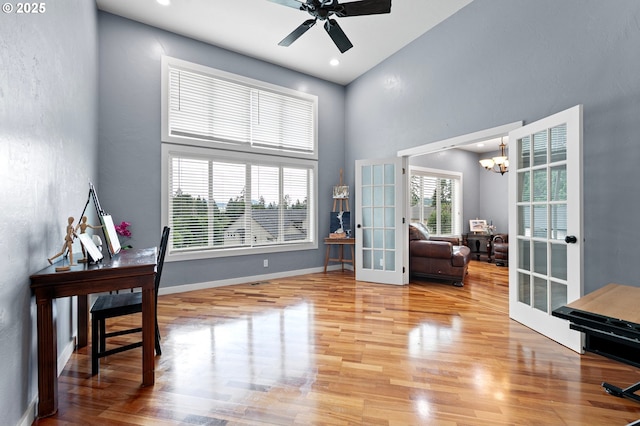 1155 Holly Ave, Cottage Grove, OR 97424 - office space featuring french doors, a towering ceiling, wood finished floors, a chandelier, and ceiling fan