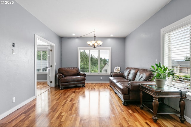 1155 Holly Ave, Cottage Grove, OR 97424 - living area featuring a chandelier, plenty of natural light, and light wood finished floors