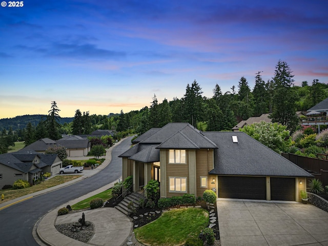 1155 Holly Ave, Cottage Grove, OR 97424 - view of front facade with an attached garage, concrete driveway, and roof with shingles