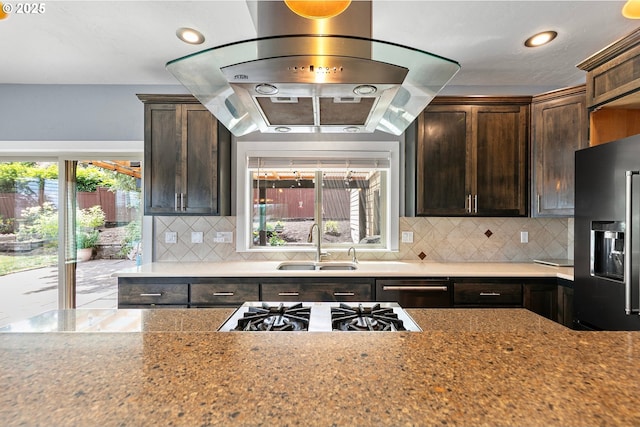 1155 Holly Ave, Cottage Grove, OR 97424 - kitchen featuring stainless steel gas cooktop, plenty of natural light, fridge with ice dispenser, dark brown cabinets, and recessed lighting